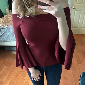 Red off the shoulder shirt with bell sleeves